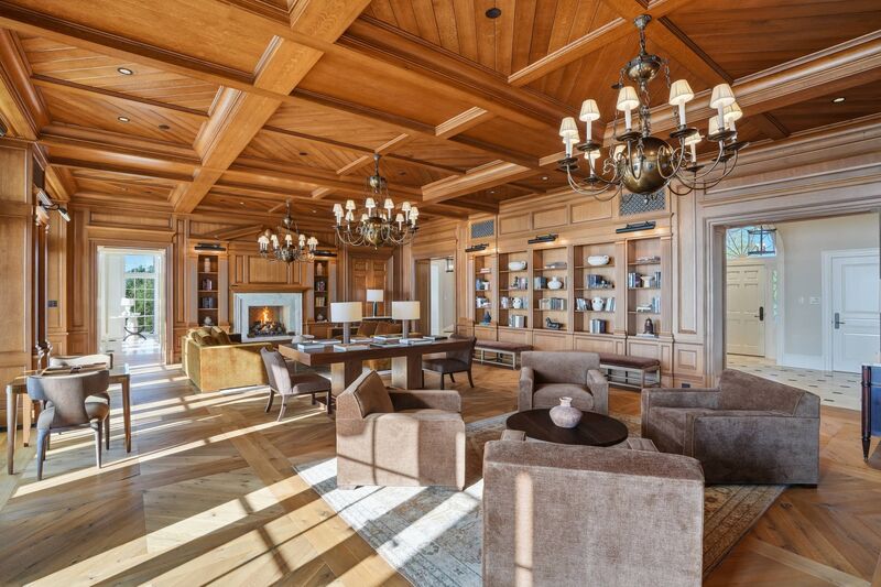 Living room with marble fireplace and built-ins